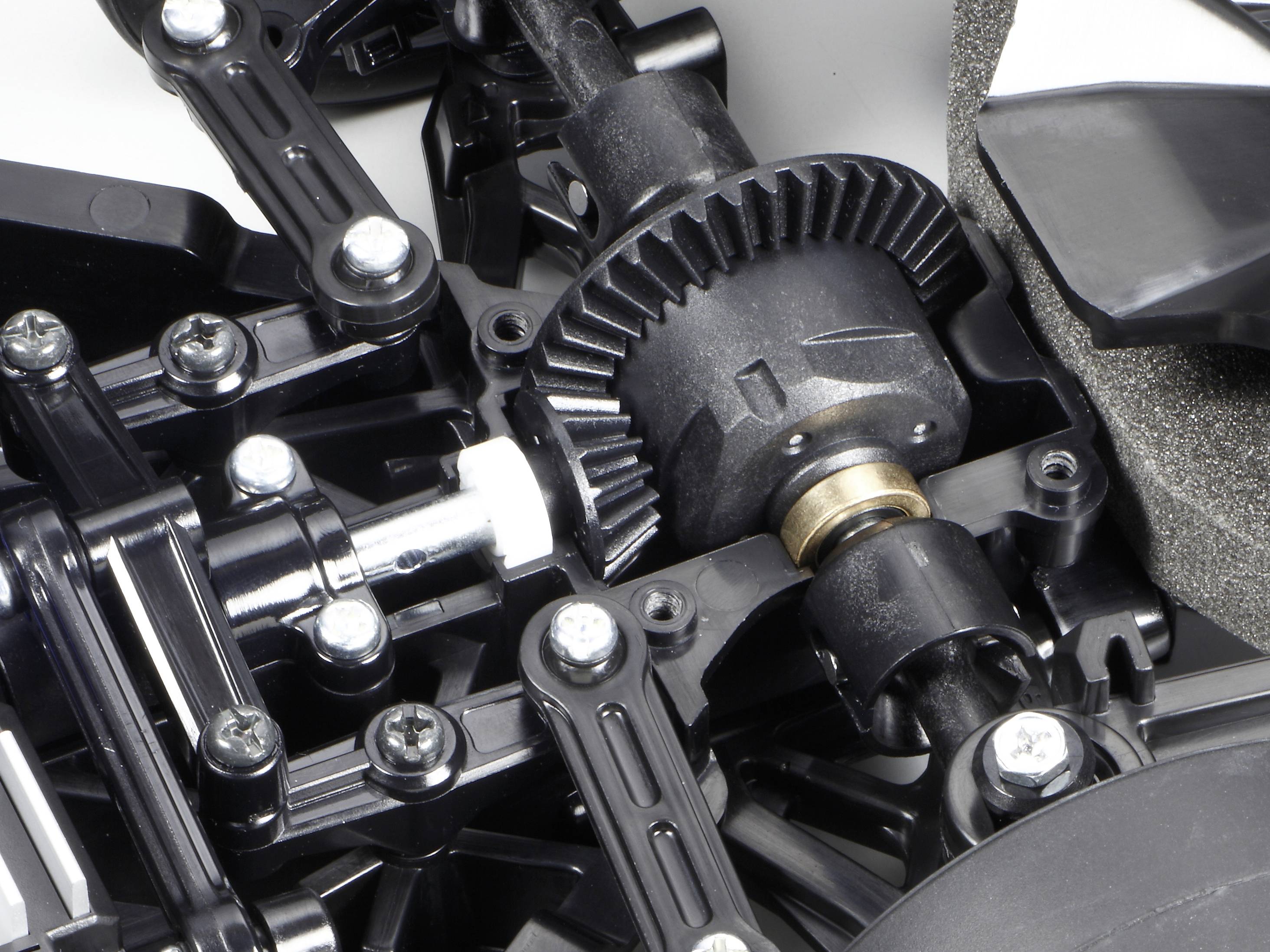 Nahaufnahme eines mechanischen Getriebes mit Zahnrädern und Schrauben, das Teil eines größeren Maschinenbauteils ist.