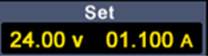 Anzeigedisplay mit den Werten: 'Set', '24.00 v', '01.100 A', die die Spannung und den Strom eines Geräts darstellen.