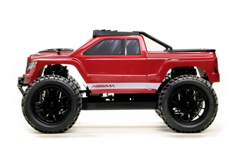 Roter Spielzeug-Monstertruck mit großen schwarzen Rädern, seitlicher Blick. Geeignet für Kinder oder Sammler.