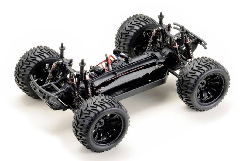 Ein RC-Auto-Chassis ohne Karosserie, zeigt die Aufhängungen, Reifen und Motoranordnung. Ideal für Modellbau-Enthusiasten.