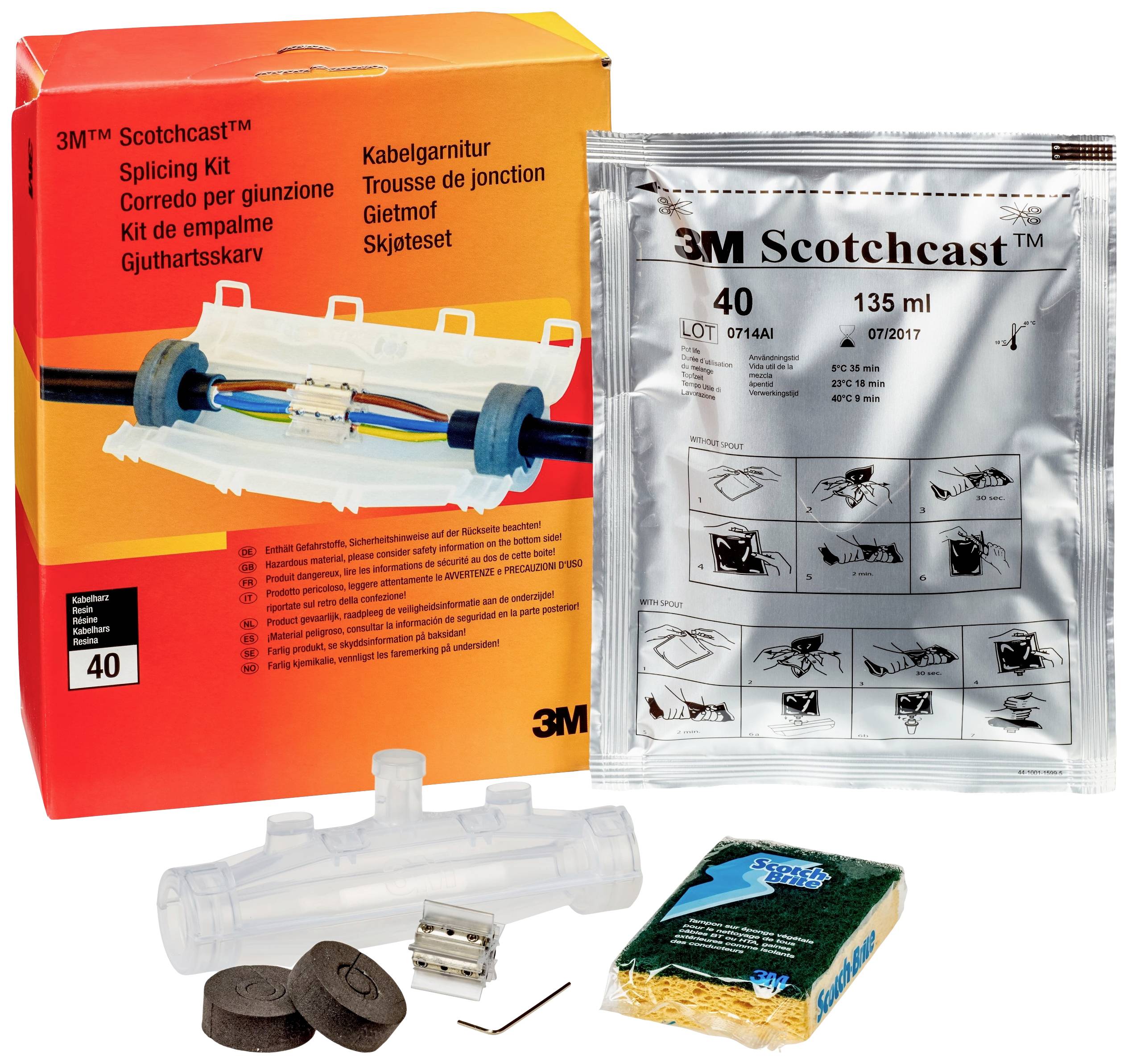 '3M Scotchcast Kabelgarnitur' Kit-Verpackung zeigt Zubehör zur Kabelverbindung, einschließlich Gießharztüte, Gehäuse und Klemmen.