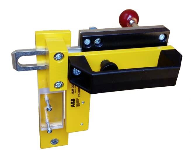 Gelbes und schwarzes mechanisches Gerät mit Griff und Metallschrauben, vermutlich ein Klemmsystem für industrielle Anwendungen.