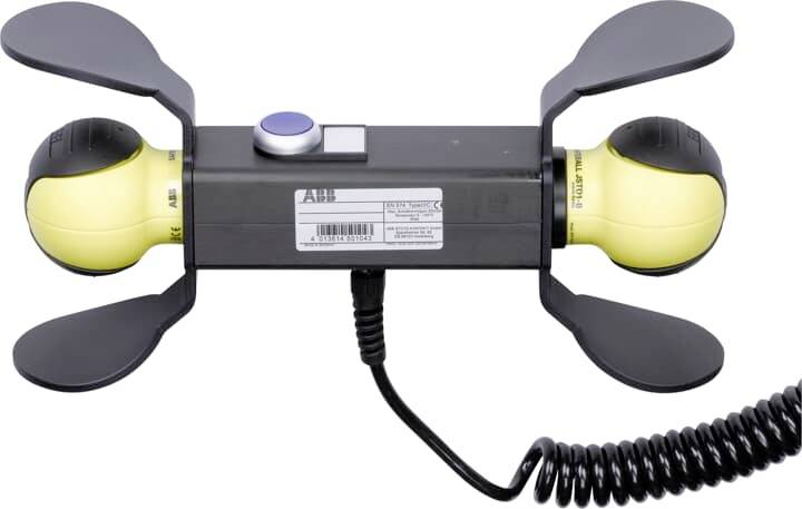 Ein elektrisches Bedienelement mit Drehgriff und Stopptaste, geeignet zur Steuerung von Maschinen oder Geräten in industriellem Umfeld.
