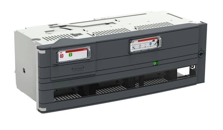 Ein graues elektrisches Gerät mit Lüftungsschlitzen und Kontrollanzeigen. Es hat zwei beleuchtete Anzeigefelder und eine rechteckige Form.
