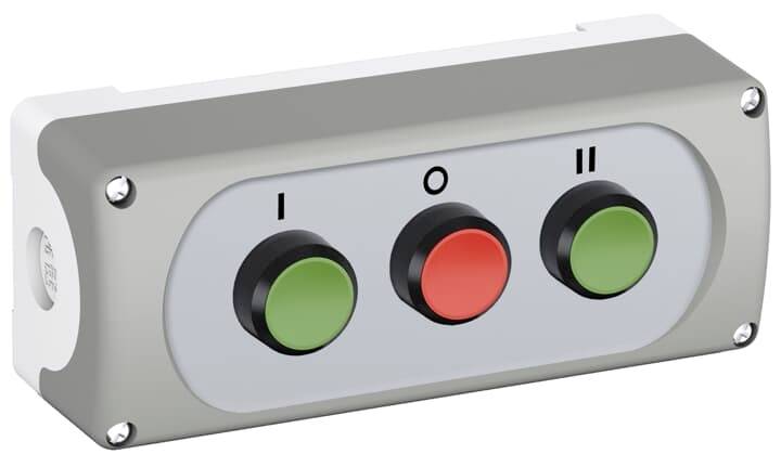 Graues Bedienfeld mit drei farbigen Knöpfen: links grün 'I', Mitte rot 'O', rechts grün 'II'. Steuerung oder Maschinenbedienung.