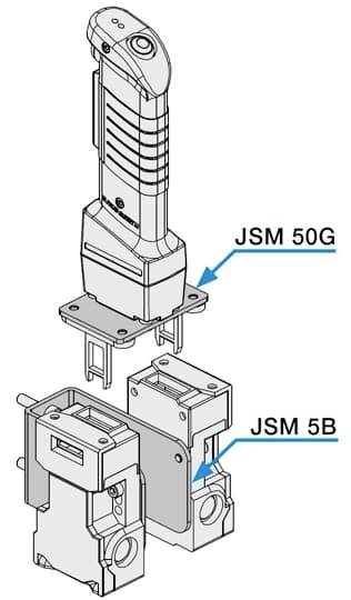 Explosionszeichnung eines Griffs 'JSM 50G' und eines Moduls 'JSM 5B', verbunden durch Pfeile. Zeigt technische Struktur und Verbindung.