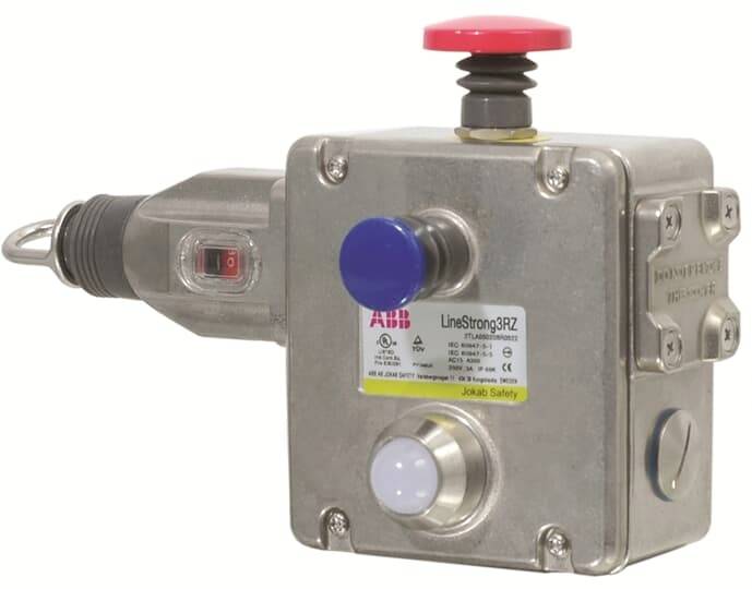 Ein silbernes Sicherheitsschaltgerät mit rotem Not-Aus-Knopf und blauem Bedienelement von ABB für industrielle Anwendungen.