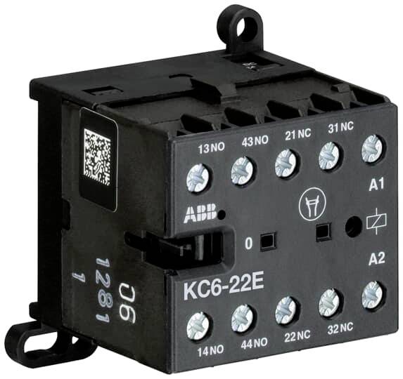 Kleines, schwarzes elektrisches Bauteil mit mehreren Anschlüssen und der Beschriftung 'KC6-22E' auf der Vorderseite.