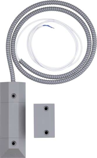 Ein grauer, rechteckiger Magnetsensor mit Kabel und zwei Löchern, verwendet in Sicherheitssystemen zur Erkennung von Tür- oder Fensteröffnungen.
