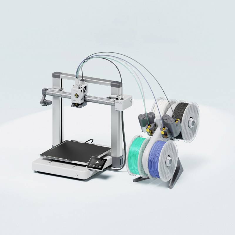 3D-Drucker mit dualen Filament-Spulen in Blau und Grau. Gerät zeigt modernen, kompakten Aufbau geeignet für präzises Drucken.