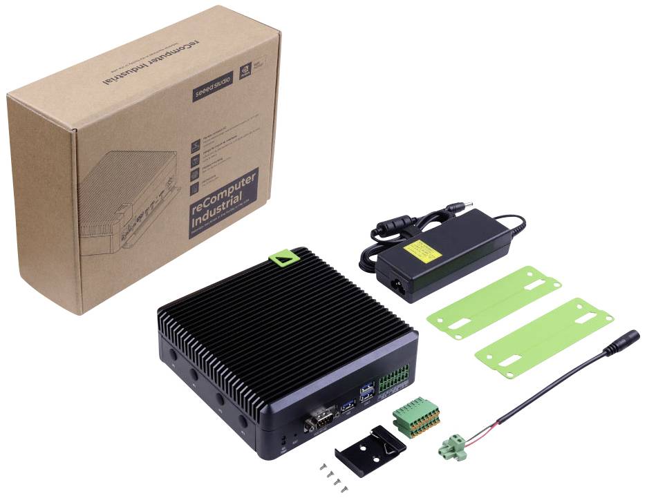 Industrie-Computer-Kit mit Gehäuse, Netzteil, grünen Halterungen, Schrauben und Adapter. Verpackung im Hintergrund.