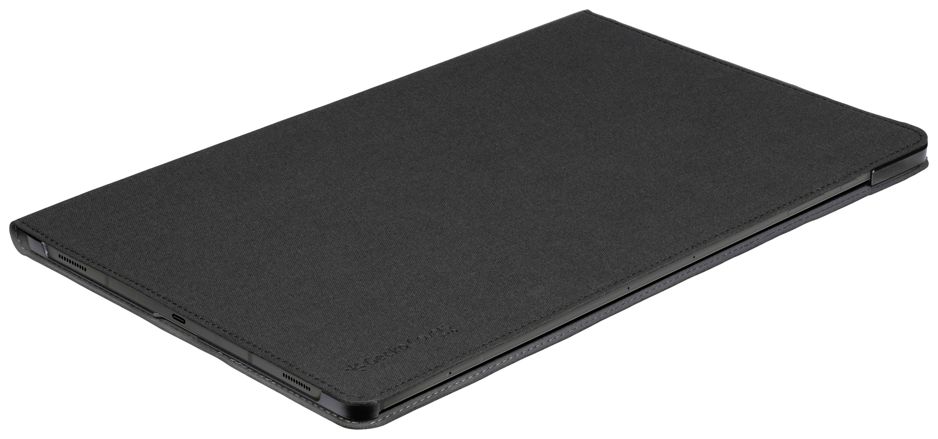 Ein geschlossenes schwarzes Tablet mit schmalem Profil liegt flach auf einer Oberfläche.