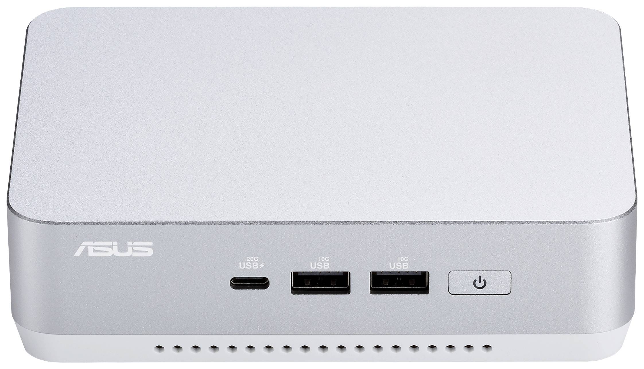 Ein silberner ASUS-Minicomputer mit zwei USB-Anschlüssen, einem USB-C-Anschluss und einem Netzschalter auf der Vorderseite.