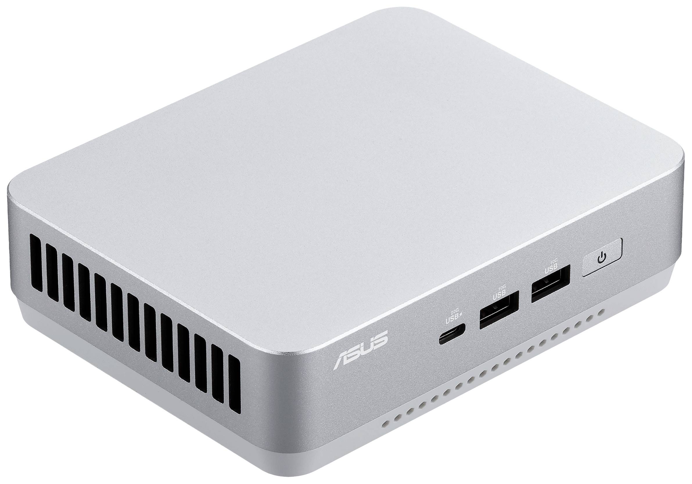 Ein silberner, rechteckiger Mini-PC mit Lüftungsschlitzen und mehreren USB-Anschlüssen auf der Vorderseite.