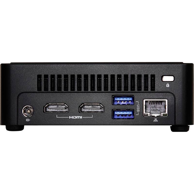 Ein schwarzer Mini-PC mit zwei HDMI-Anschlüssen, zwei blauen USB-Anschlüssen und einem Ethernet-Port auf der Rückseite.