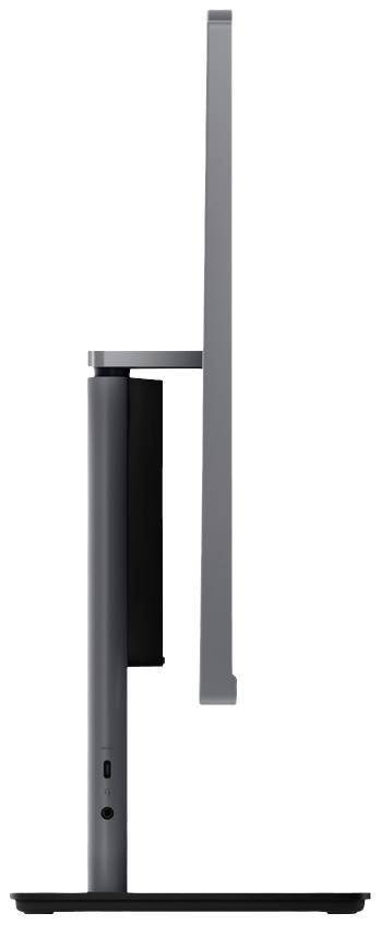 Seitenansicht eines modernen, flachen Monitors auf einem schlanken Standfuß. Das Design wirkt minimalistisch und elegant.