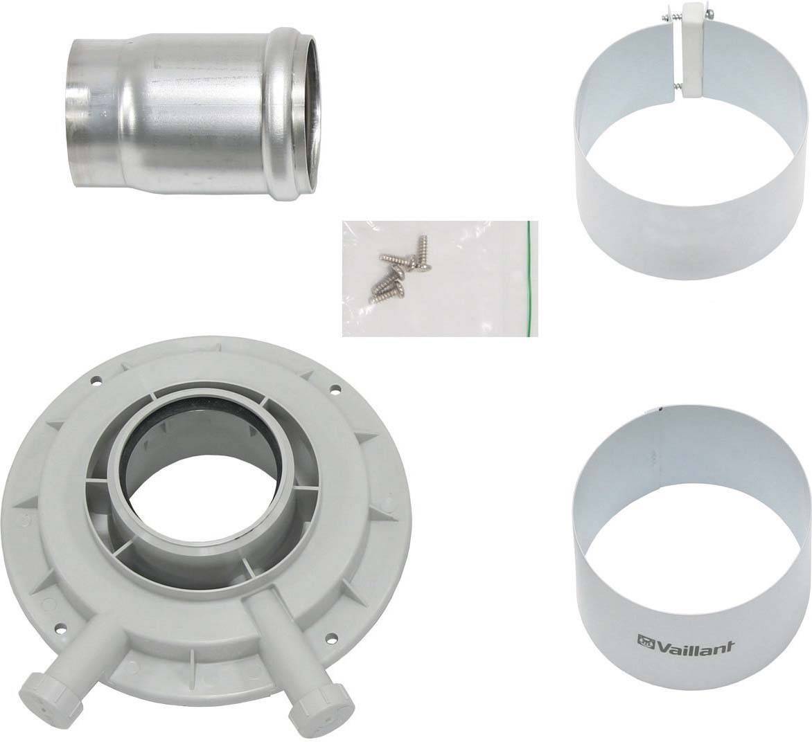 Ein Set von Komponenten für eine Heizungseinheit, bestehend aus Schrauben, einem Metallanschluss und zwei Kunststoffringen, einer davon mit 'Vaillant'-Logo.