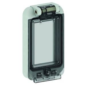 Plastikschutzhülle mit durchsichtigem Deckel und rückseitigem Rollenmechanismus. Ideal für den Schutz von Wandschaltern.