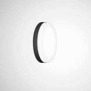 Runde, schwarze und weiße Wandleuchte, die an einer weißen Wand befestigt ist. Modernes Design mit einfacher, minimalistischer Ästhetik.