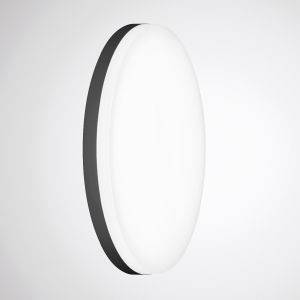 Eine ovale, weiße Lampe mit schwarzem Rand, die an der Wand montiert ist. Sie strahlt ein sanftes, gleichmäßiges Licht aus.