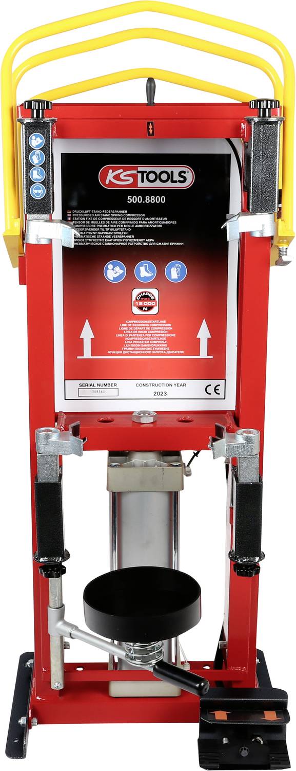 Rote Werkstattpresse mit KS Tools Logo oben, gelben Griffen und Pedal unten. Enthält Anweisungen und Sicherheitsinformationen.