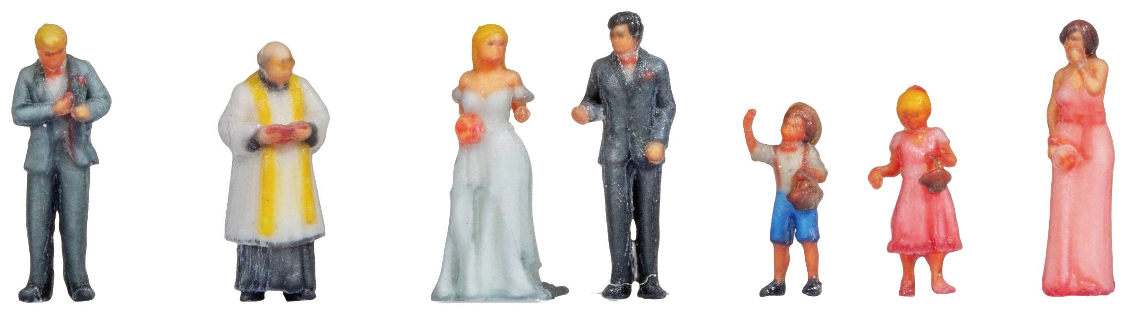 Kleine Figuren in Hochzeitskleidung: Bräutigam, Braut, Pfarrer und Gäste. Bräutigam im Anzug, Braut im weißen Kleid, Kinder in Freizeitkleidung.