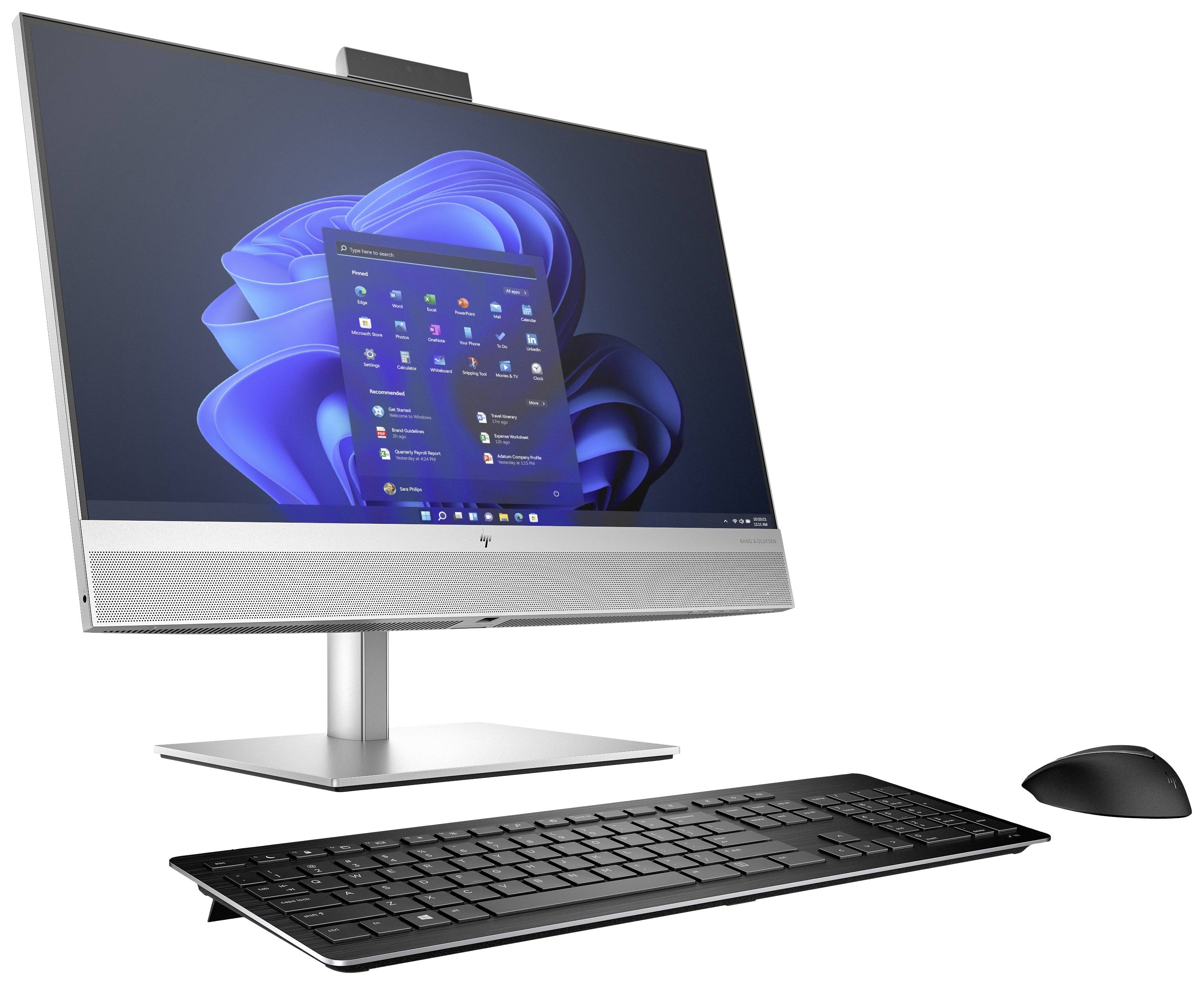 Ein moderner Desktop-Computer mit flachem Monitor, schwarzer Tastatur und Maus. Der Bildschirm zeigt ein Betriebssystem mit Icons.
