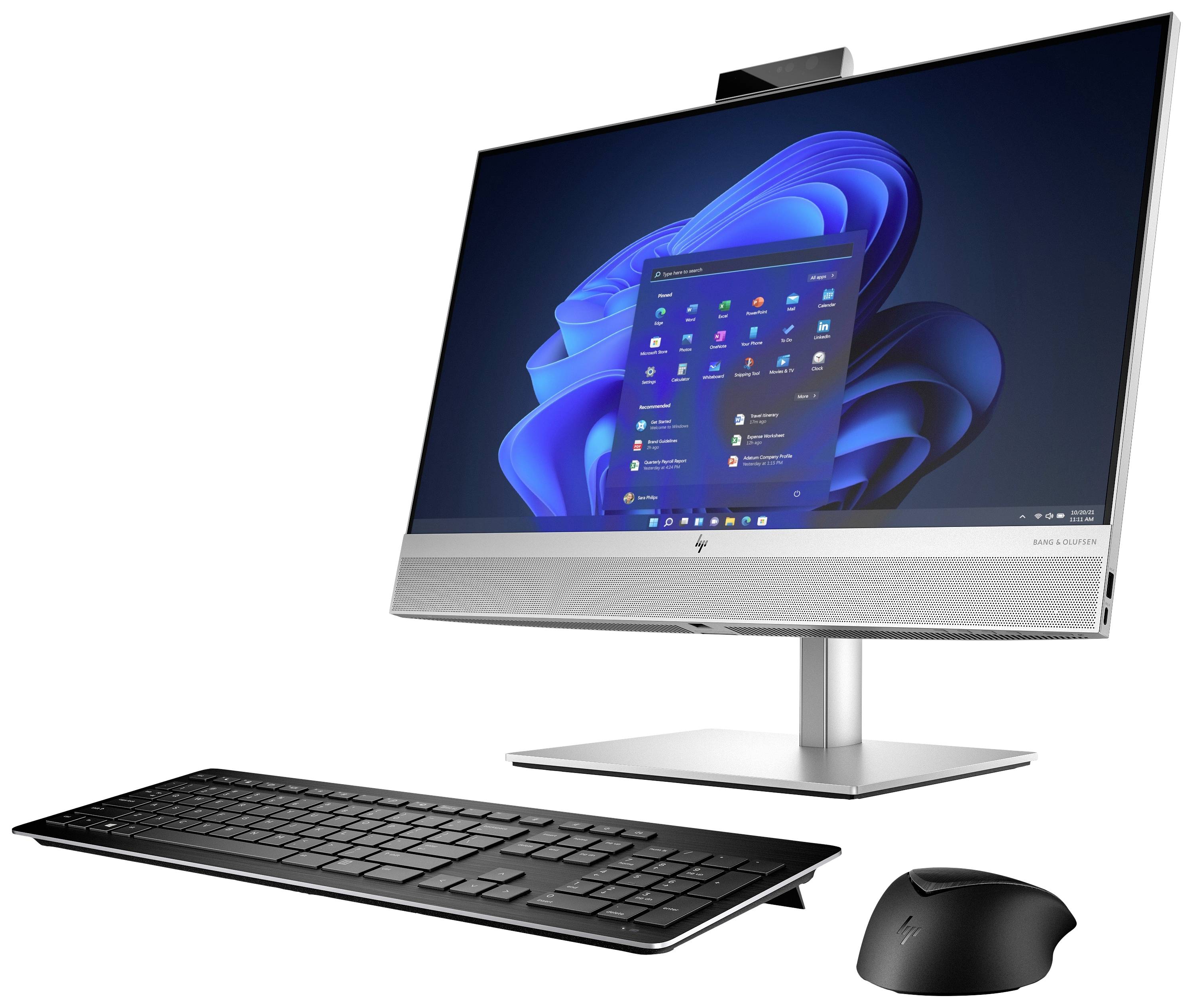 Ein moderner All-in-One-Computer mit einer Tastatur und einer Maus. Auf dem Bildschirm ist der Startbildschirm von Windows 11 zu sehen.