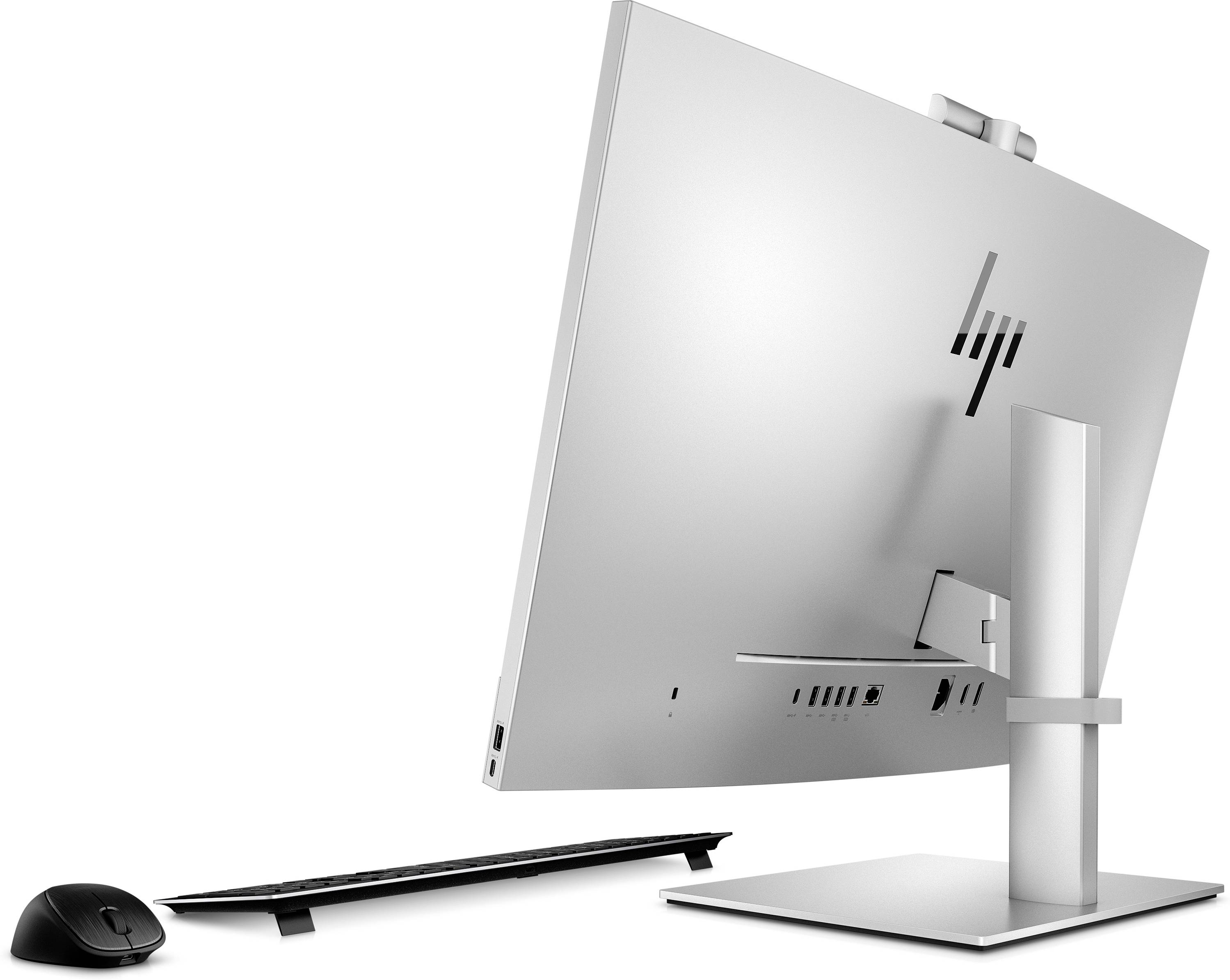 Ein moderner All-in-One-Computer mit schlankem Design, silberner Rückseite und verstellbarem Standfuß. Daneben eine schwarze Maus und Tastatur.