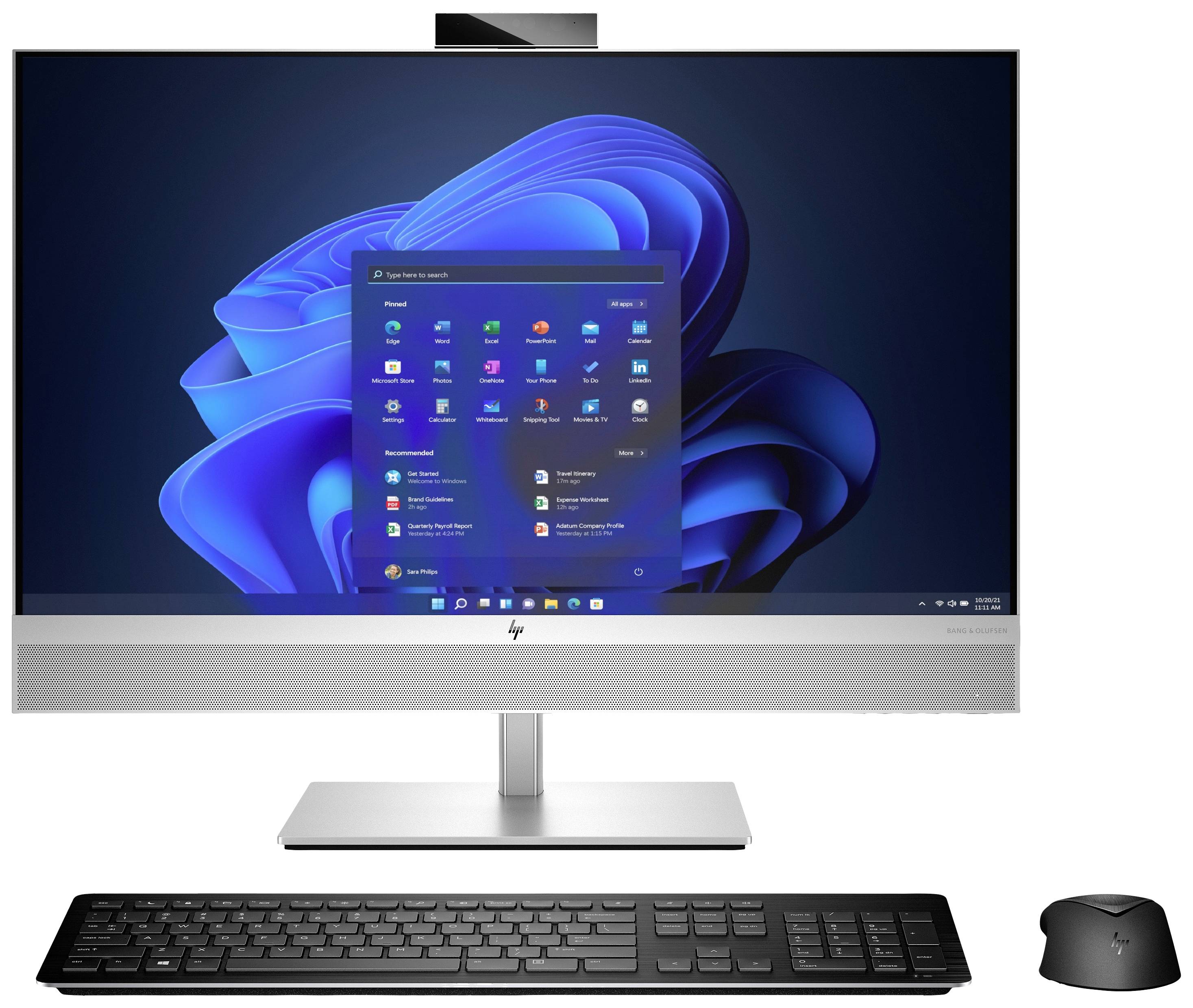 Ein Computer mit Tastatur und Maus, auf dem Bildschirm ist der Windows-Startbildschirm mit Programm-Symbolen zu sehen.