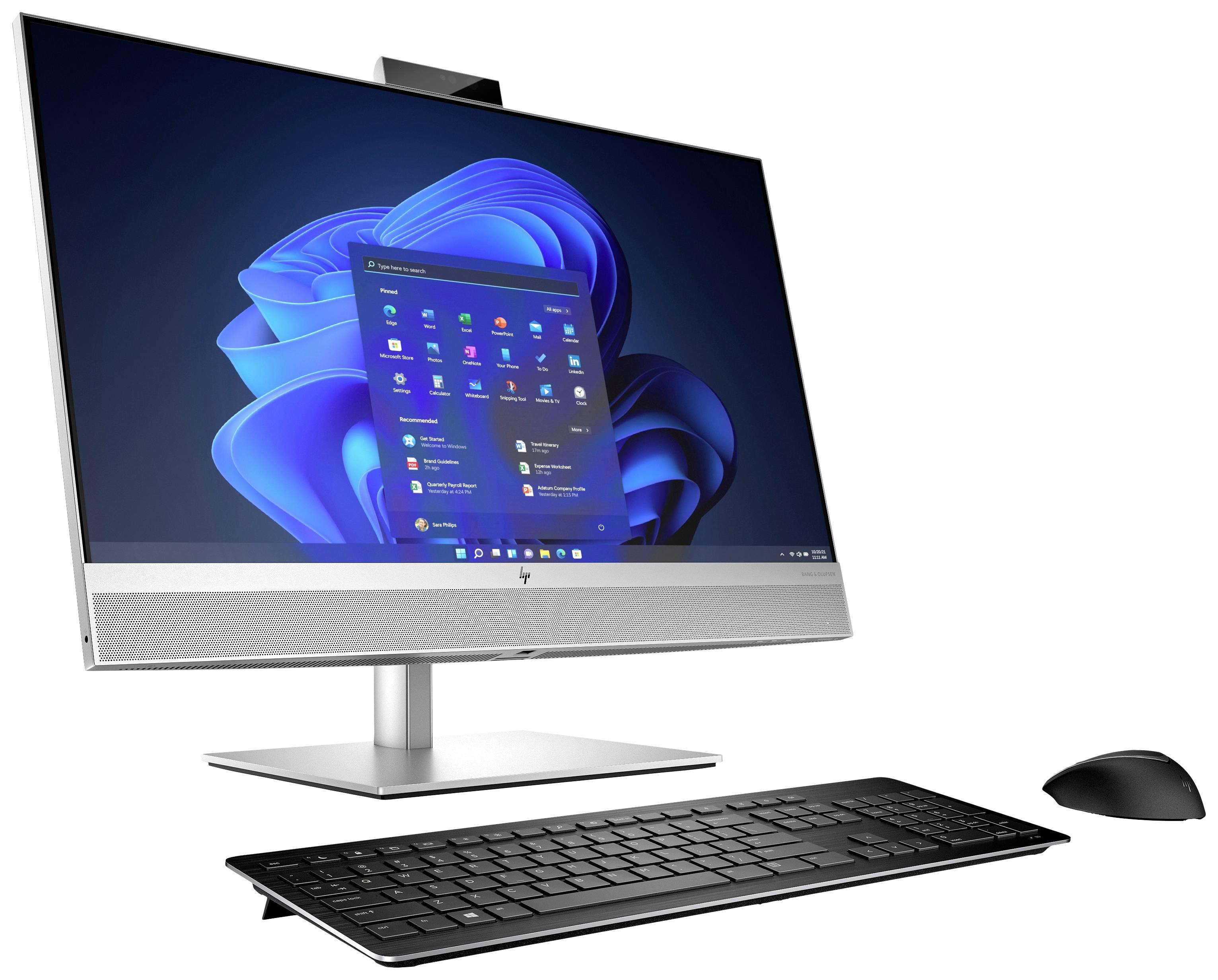 Ein moderner Desktop-Computer mit Monitor, Tastatur und Maus. Der Monitor zeigt das Windows-Startmenü auf einem blauen Hintergrund.