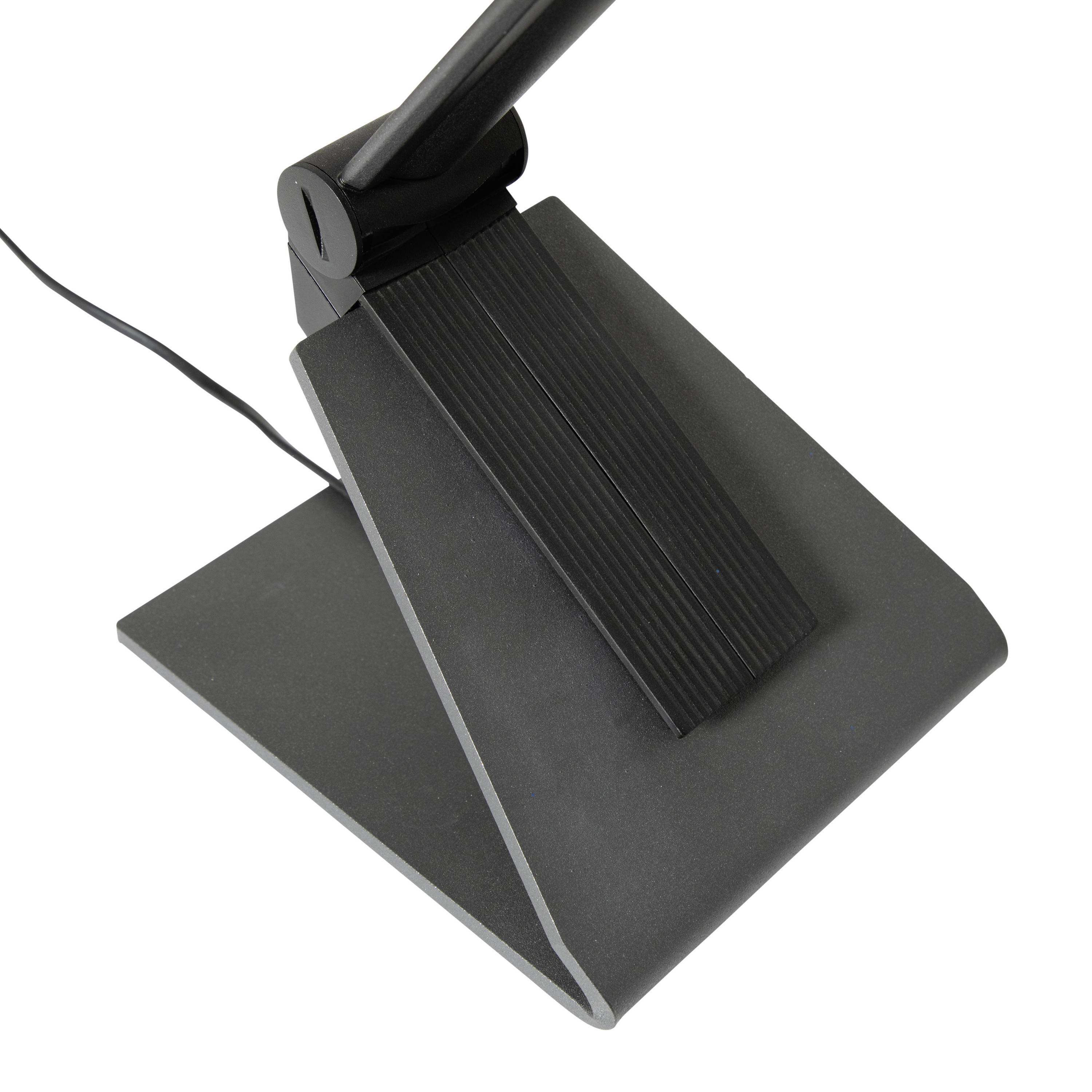 Ein schwarzer Fußschalter mit geneigter, gerippter Oberfläche und angeschlossenem Kabel. Verwendet für die Steuerung von Geräten.