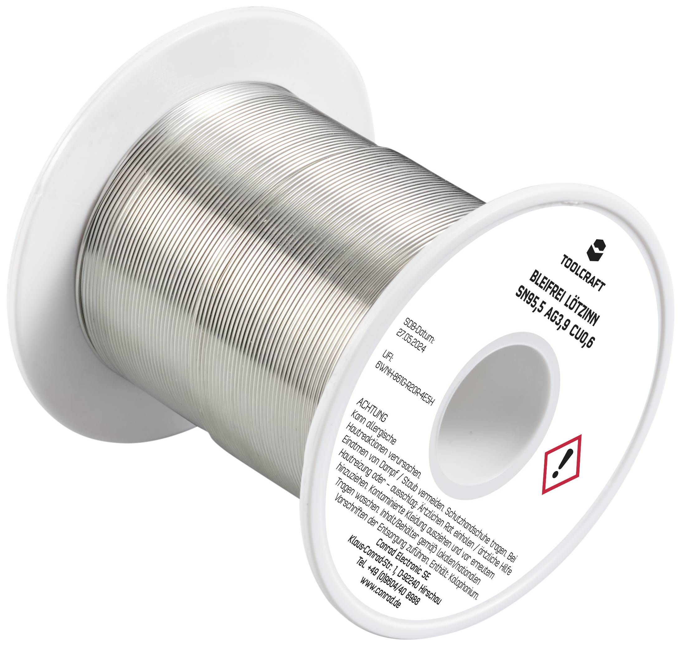 Lötdrahtrolle, beschriftet als 'Toolcraft bleifreies Lötdraht Sn95,5 Ag3,8 Cu0,6', mit Warnsymbol, silbrig glänzender Draht.