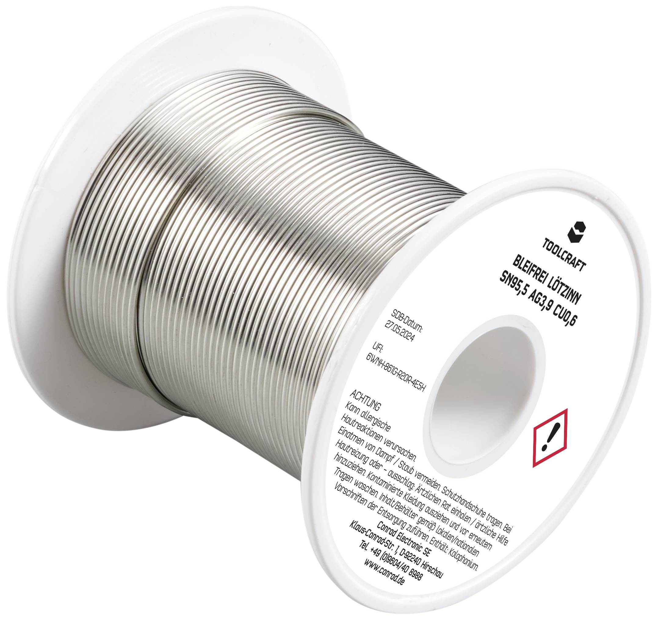 Spule mit bleifreiem Lötzinn, Aufschrift: 'Toolcraft', Typ: 'Sn95,5 Ag3 Cu0,5'. Warnhinweis symbolisiert Gesundheitsgefahr.