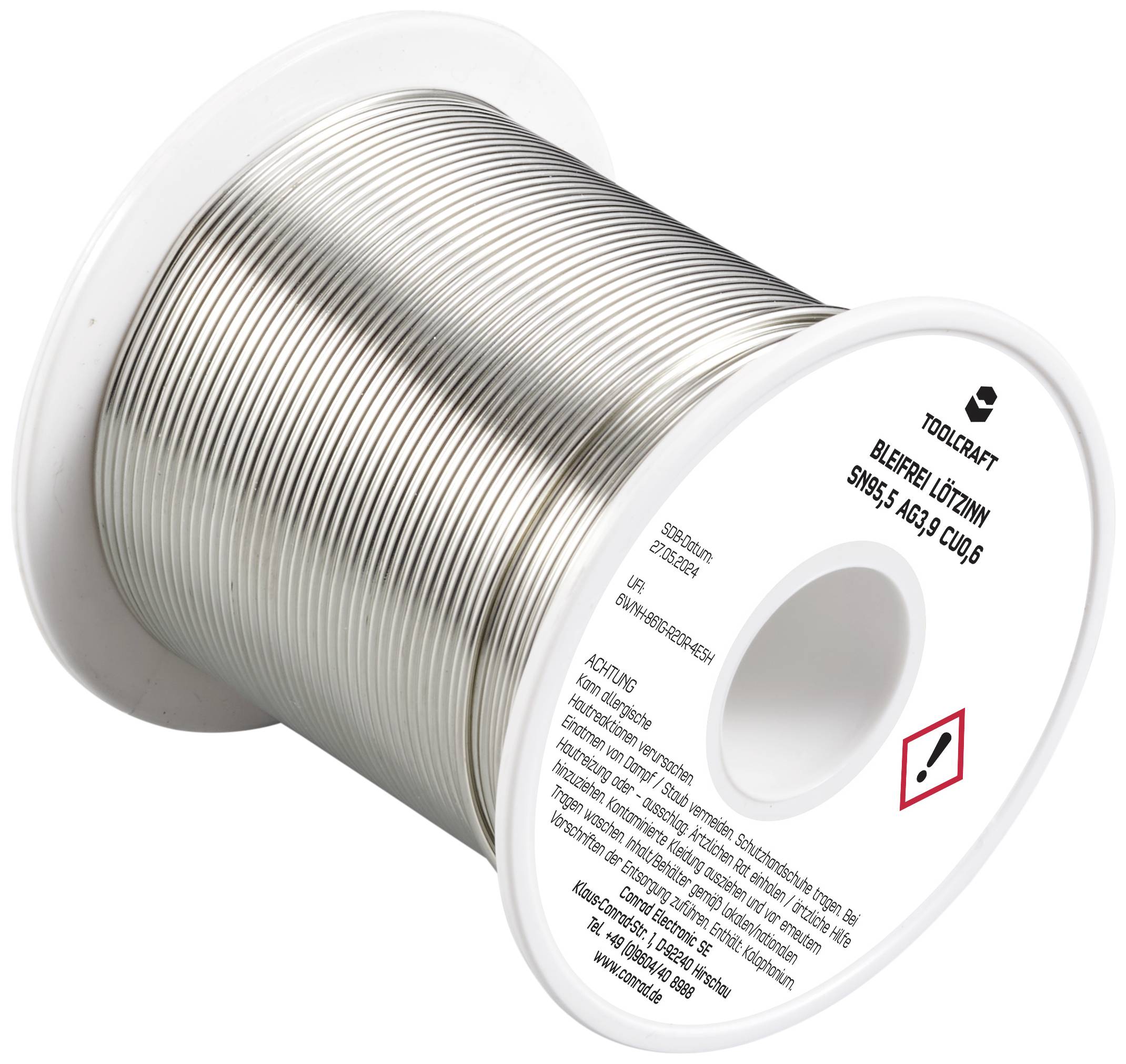 Lötzinn-Rolle, silbern, auf Kunststoffspule. Beschriftung mit Warnsymbol für gesundheitliche Vorsicht beim Umgang.