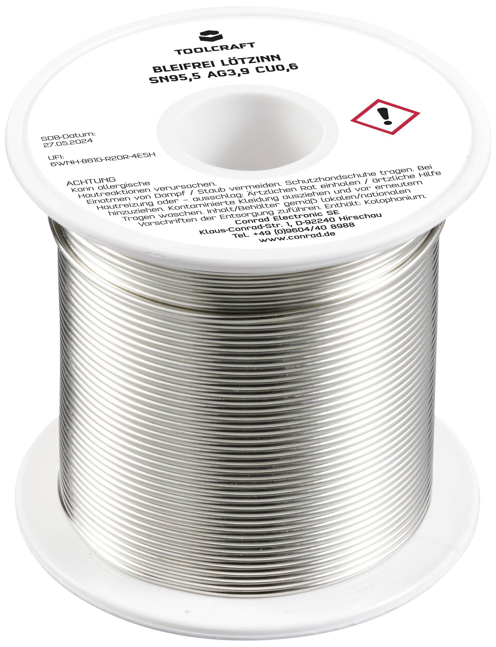 Eine Rolle bleifreies Lötzinn von Toolcraft, Typ Sn95,5 Ag3,8 Cu0,6. Warnsymbol für Gefahrenhinweis auf der Oberseite sichtbar.