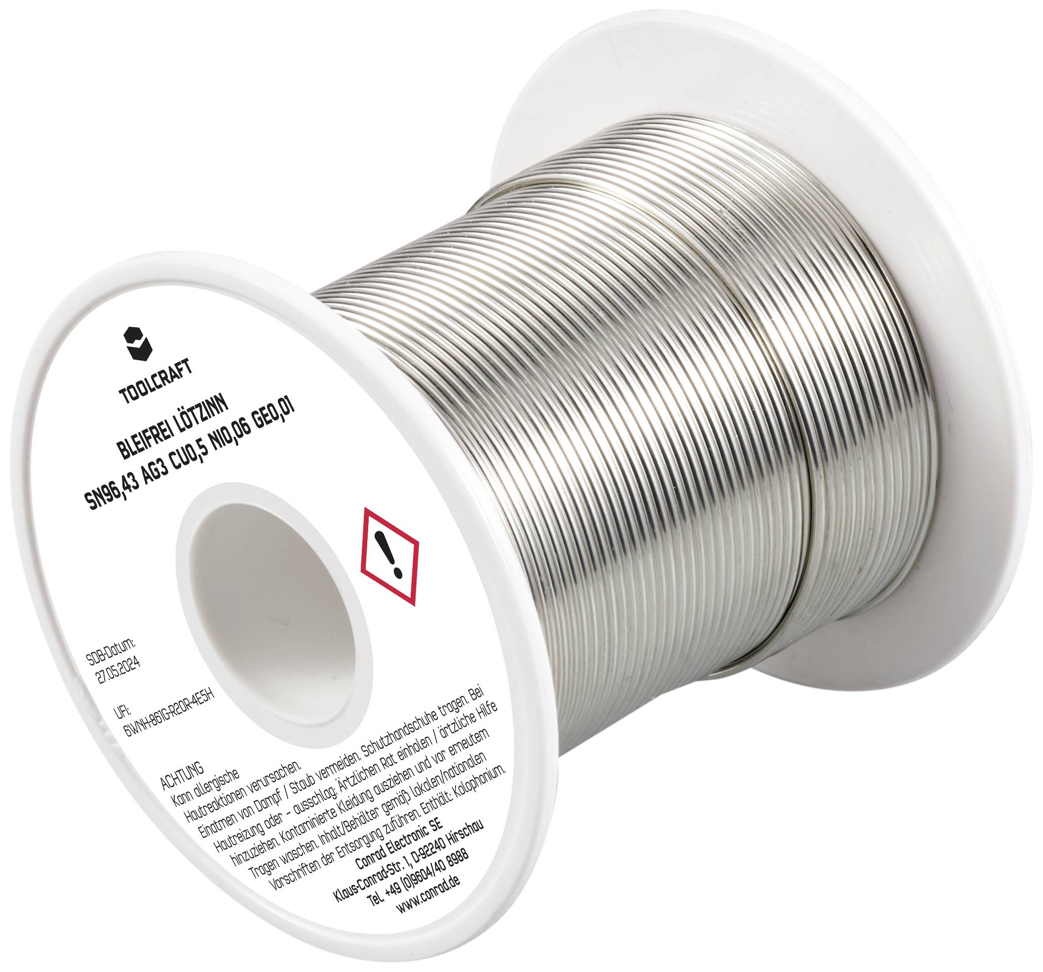 Spule mit Lötzinn, aufgedruckt mit Sicherheitshinweisen. Verwendet für elektronische Lötarbeiten.