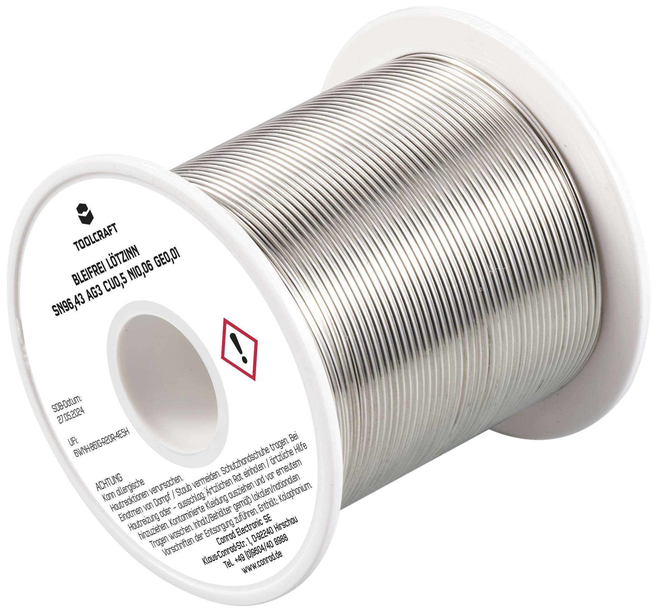 Eine Rolle Lötzinn mit Warnsymbol. Beschriftet mit 'Bleifreier Lötzinn, Sn99.3, Cu0.7'. Herstellerlogo oben, Sicherheitswarnungen unten.