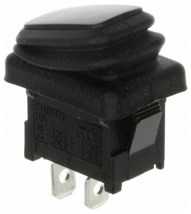 Ein schwarzer rechteckiger Druckschalter mit Metallstiften für elektrische Verbindungen, mit der Aufschrift 