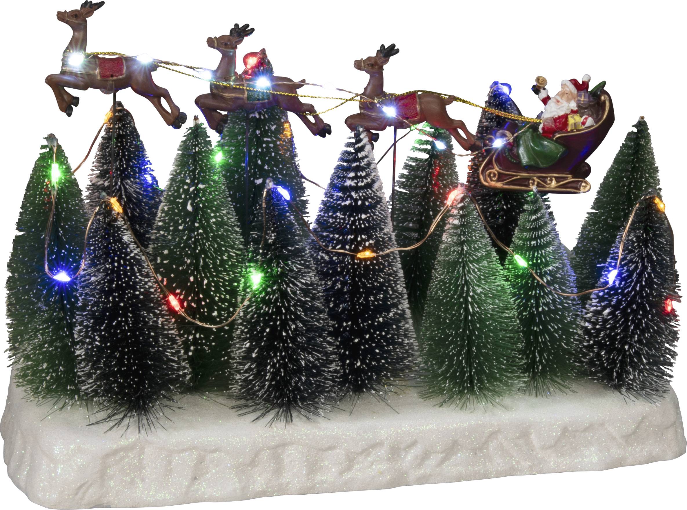 Weihnachtsszene mit beleuchteten Miniaturtannenbäumen. Oben fliegt ein Schlitten mit Rentieren, der Weihnachtsmann sitzt mit Geschenken darin.