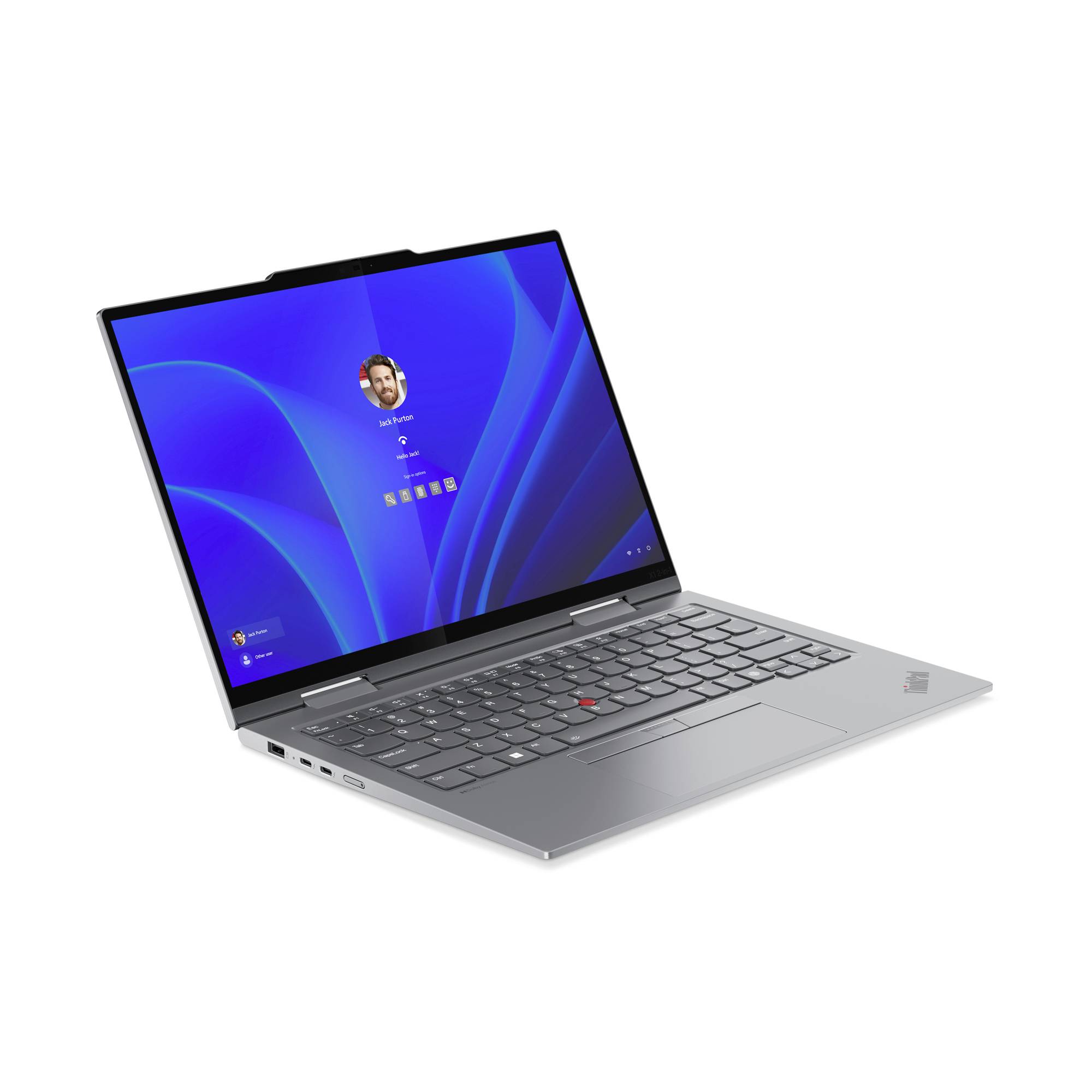Ein silberner Laptop mit geöffneter Windows-Anmeldeseite auf dem Bildschirm. Der Laptop ist leicht angewinkelt zur rechten Seite.