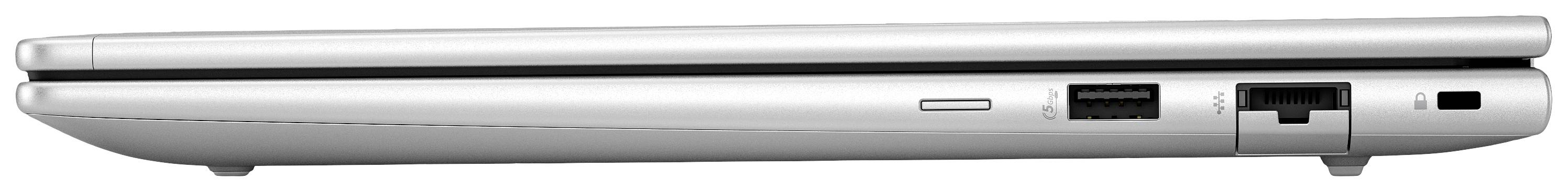 Ein geschlossenes, silbernes Laptop von der Seite gezeigt, mit sichtbaren Anschlüssen für USB und Ethernet.