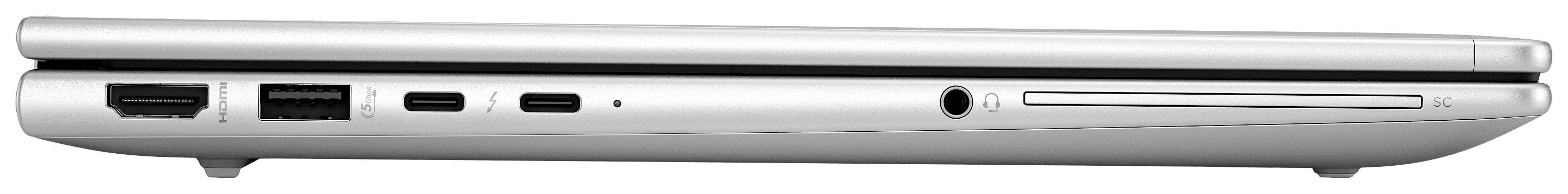 Silberner Laptop von der Seite gezeigt, mit sichtbaren Anschlüssen: HDMI, USB, zwei USB-C und Audioanschluss.