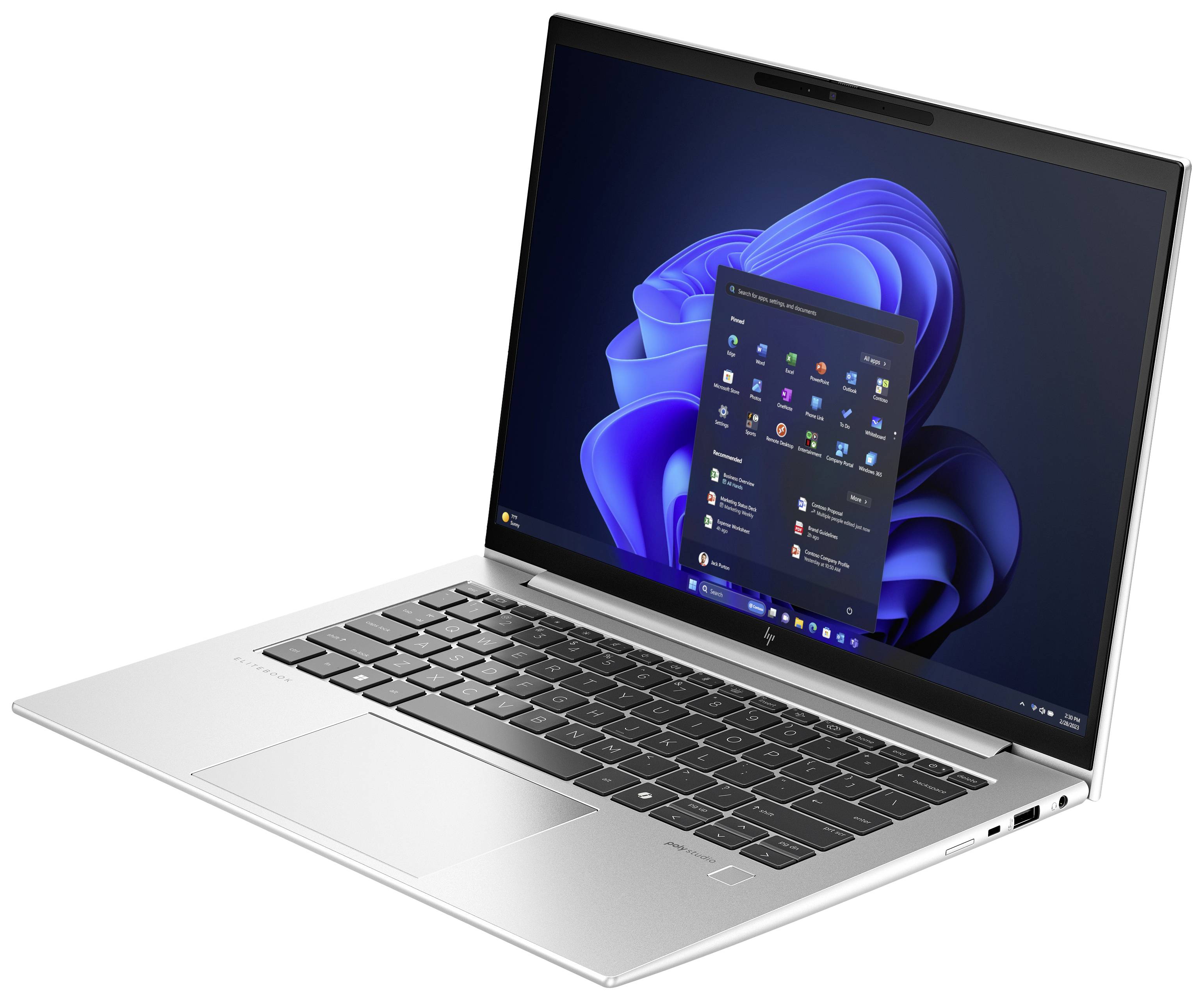 Ein silberner Laptop mit aufgeklapptem Bildschirm zeigt den Windows-Startbildschirm mit App-Symbolen und Windows 11-Hintergrund.