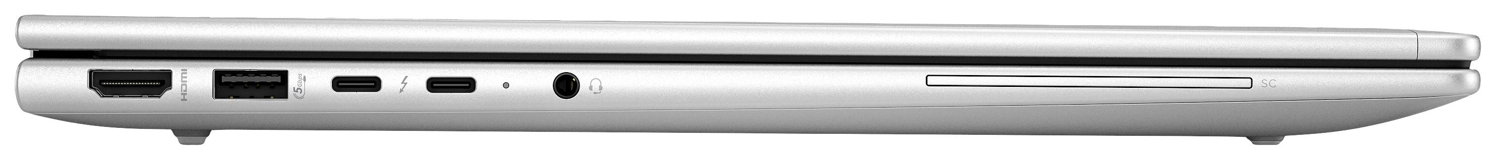 Ein geschlossenes Laptop in Seitenansicht zeigt verschiedene Anschlüsse: USB-Ports, HDMI und Kopfhörerbuchse.