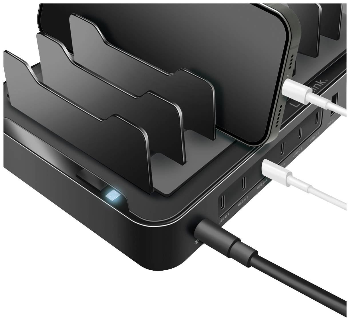 Eine schwarze Ladestation mit mehreren Steckplätzen lädt verschiedene elektronische Geräte gleichzeitig.