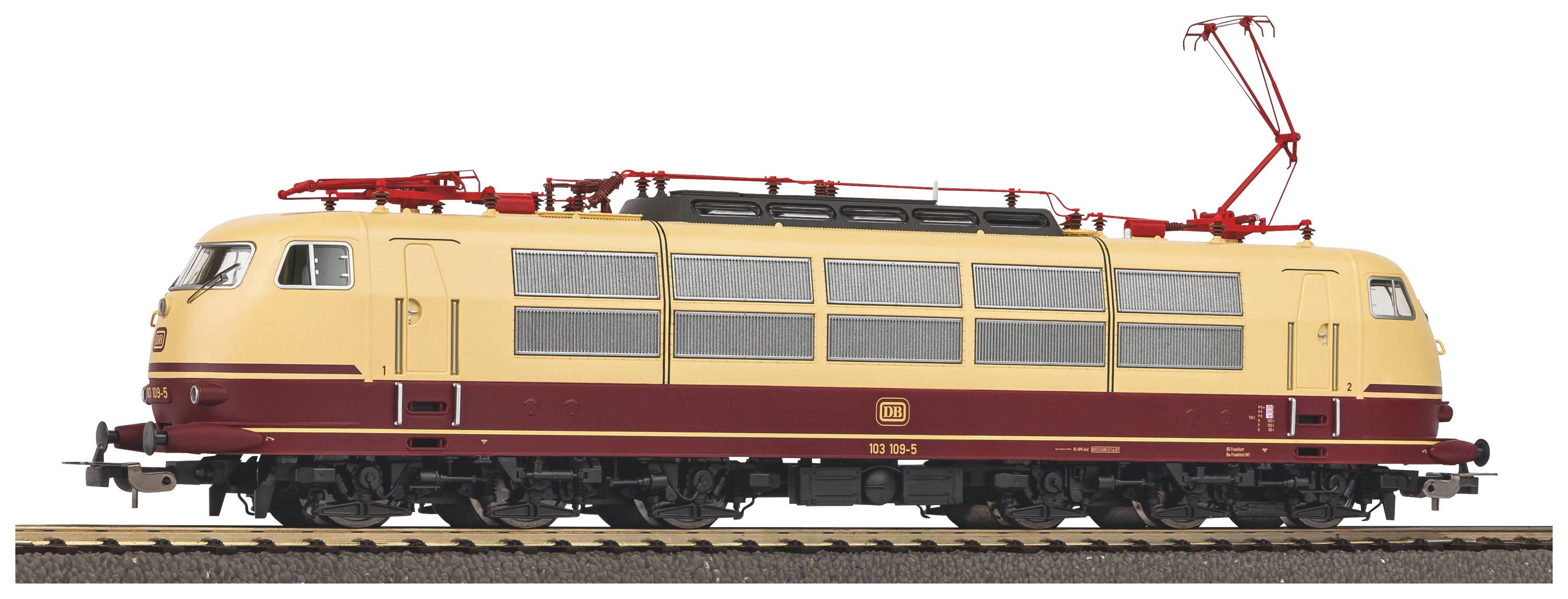 Das Bild zeigt eine beige und rot-braune Lokomotive auf Gleisen, mit stromabnehmendem Dachaufbau und stromlinienförmigem Design.