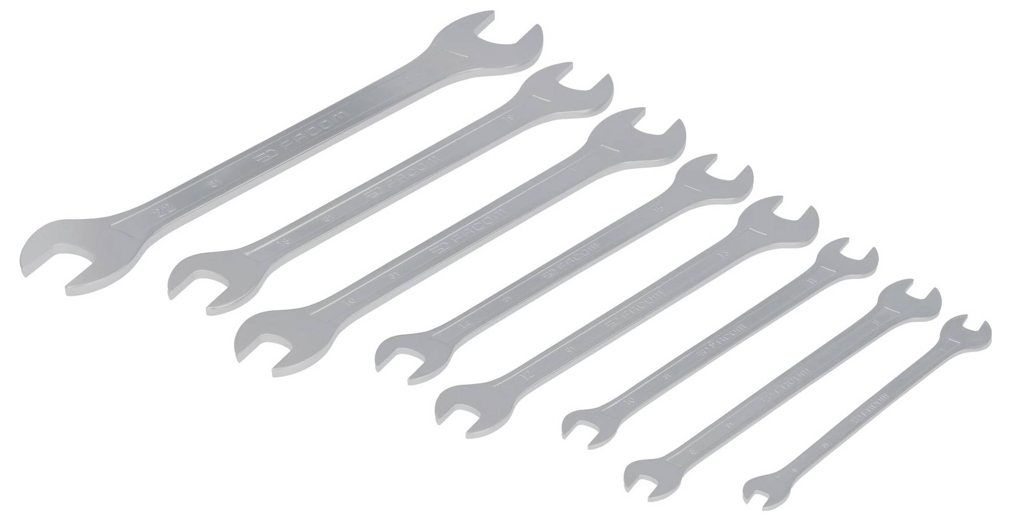 Sieben Schraubenschlüssel in verschiedenen Größen, von groß nach klein angeordnet.