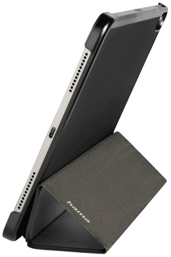 Ein schwarzes Tablet steht schräg in einer schwarzen Hülle, die als Ständer dient. Lautsprecher und Anschluss sind sichtbar.