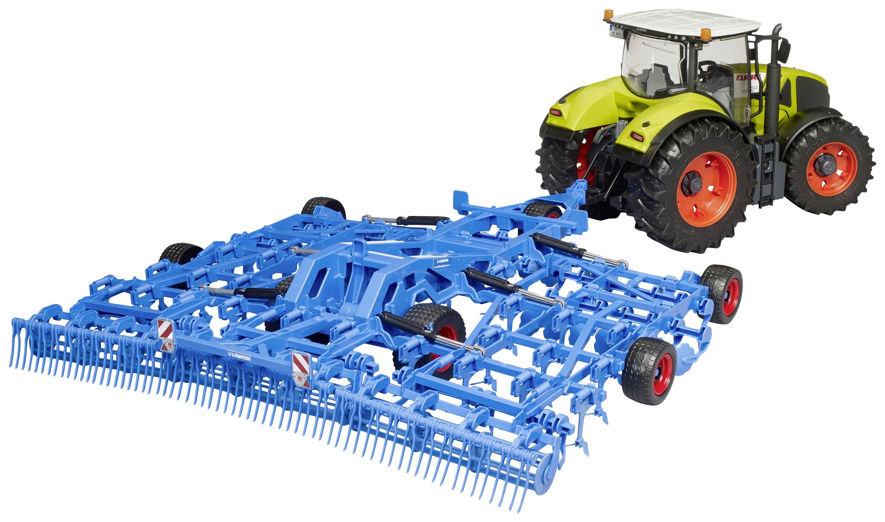 Ein grüner Traktor zieht ein großes blaues landwirtschaftliches Gerät über ein Feld.